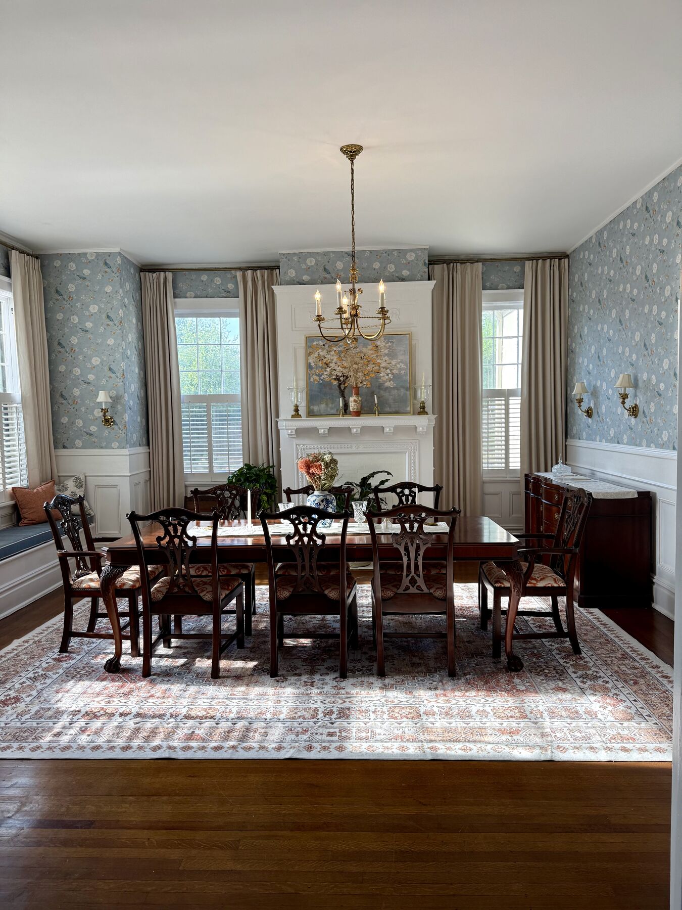 Formal dining room with peacock wallpaper