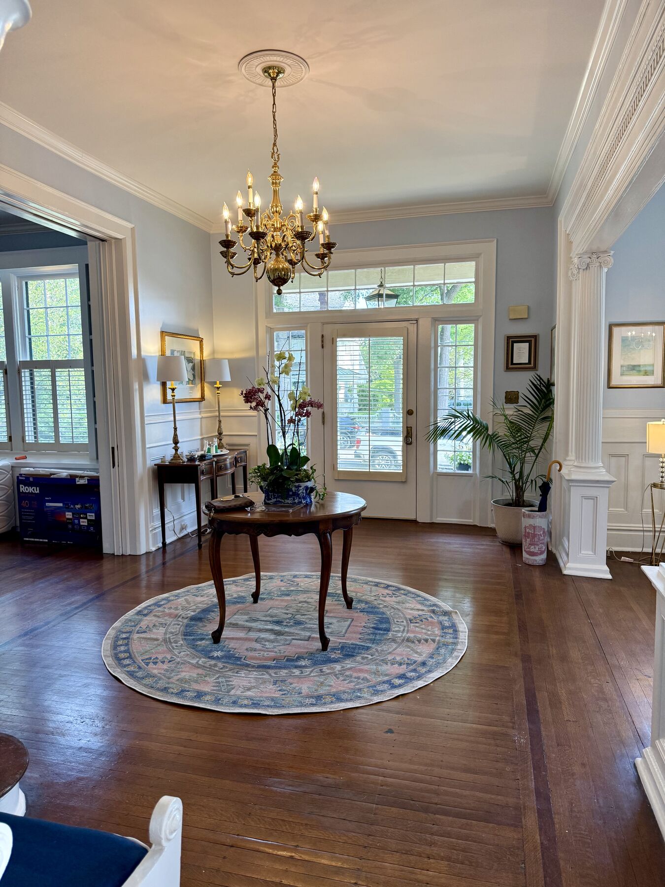 Grand foyer with brass chandelier