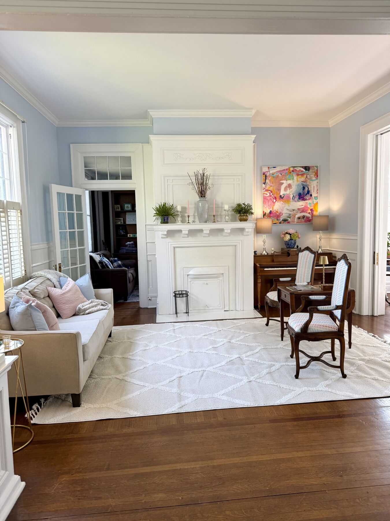 Formal living room with white mantel