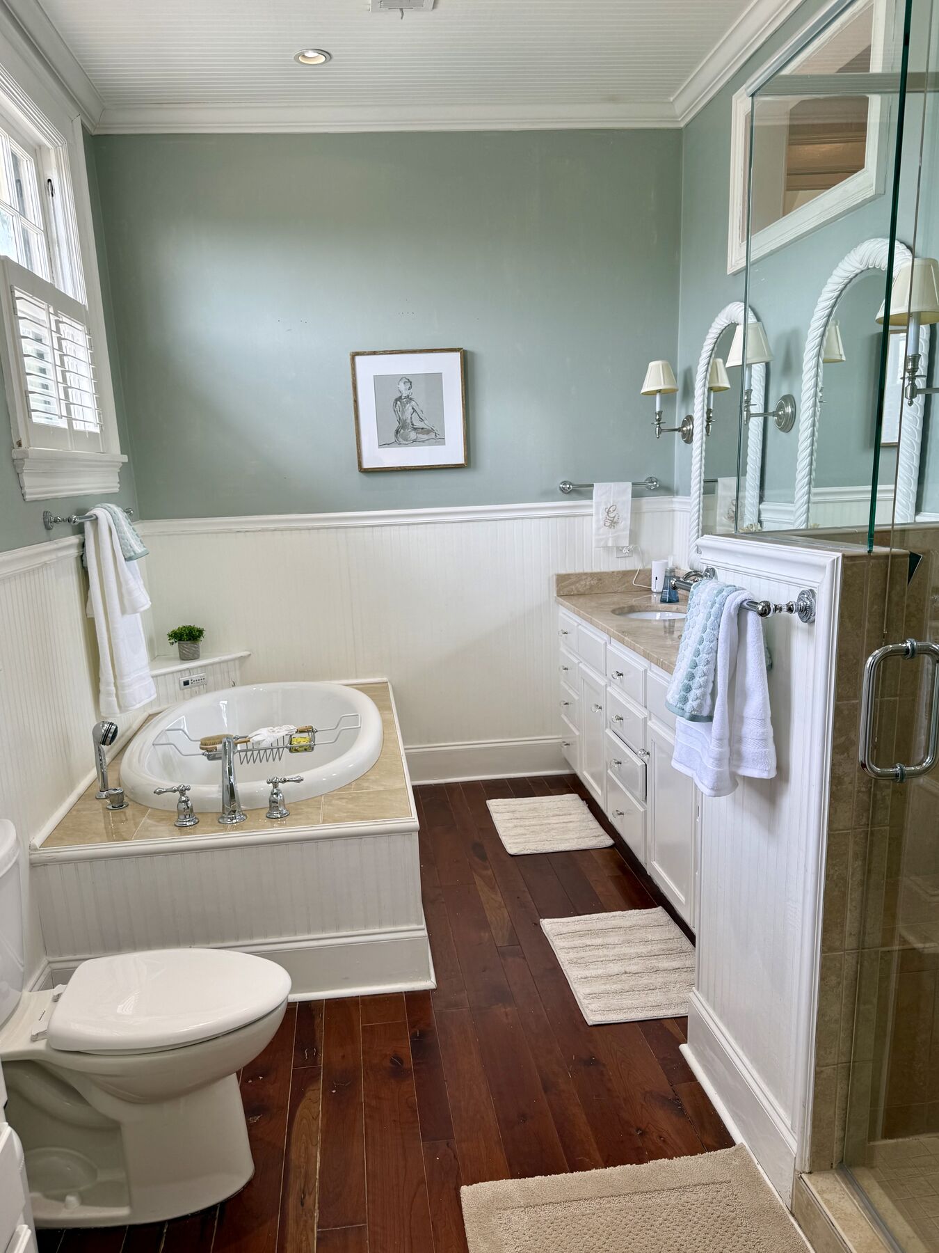 Sage-walled bath with soaking tub