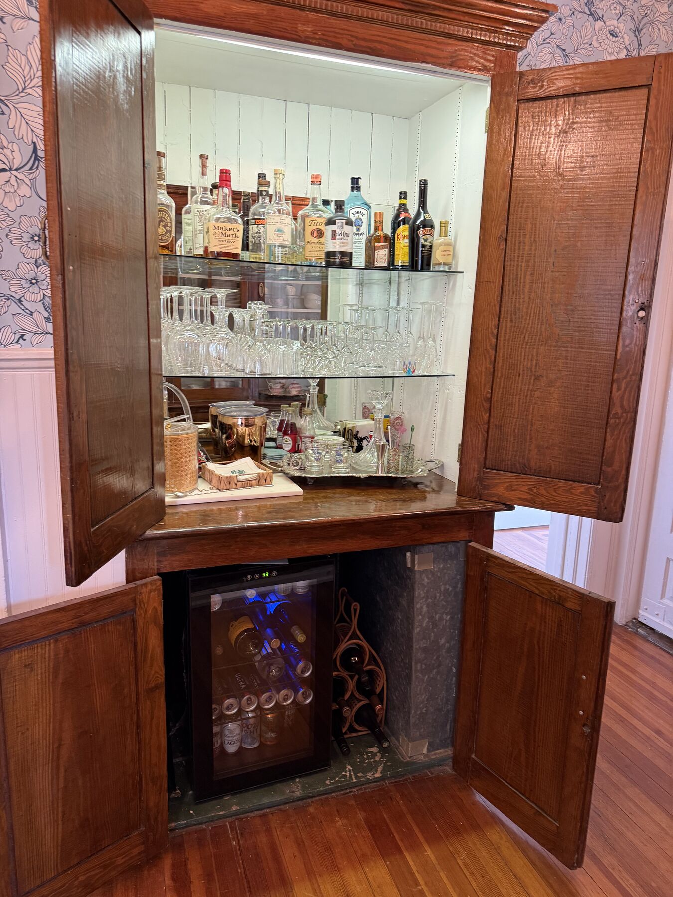 Built-in wet bar with glassware and wine cooler